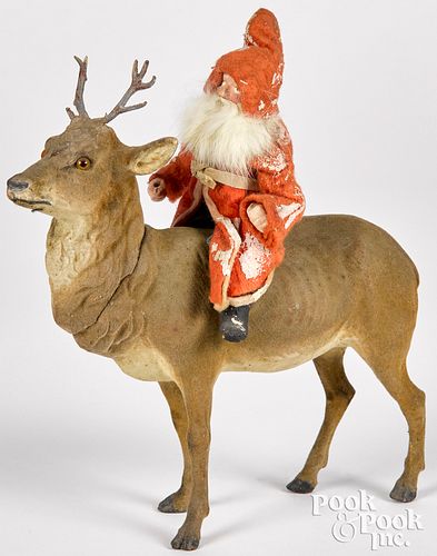 Father Christmas on a reindeer candy container