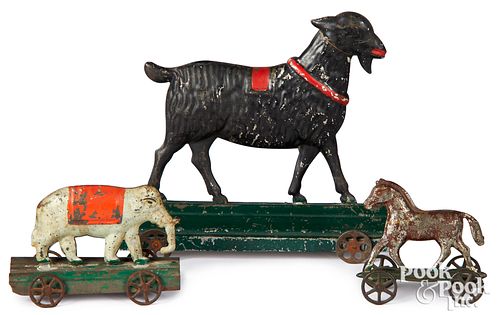 Three early painted tin platform pull toys