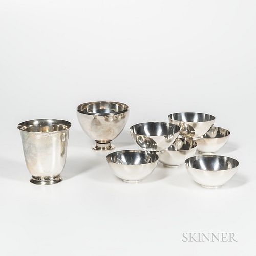 Eight Pieces of Georg Jensen Sterling Silver Tableware, Denmark, early to mid-20th century, six small bowls pattern no. 580C, designed