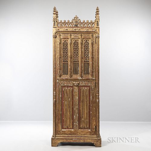 Gothic-style Carved and Gilded Cabinet, with carved tracery throughout and single door enclosing a shelved interior, ht. 99 1/2, wd. 33