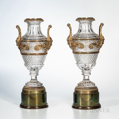 Pair of Gilt-bronze-mounted Crystal Urns on Drum Bases, 19th century, bronze acanthus borders with central arabesque foliate designs te