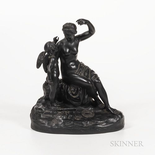 Wedgwood Black Basalt Cupid Disarmed Group, England, 19th century, after a model by Giovanni Meli, the seated figure of Venus modeled s