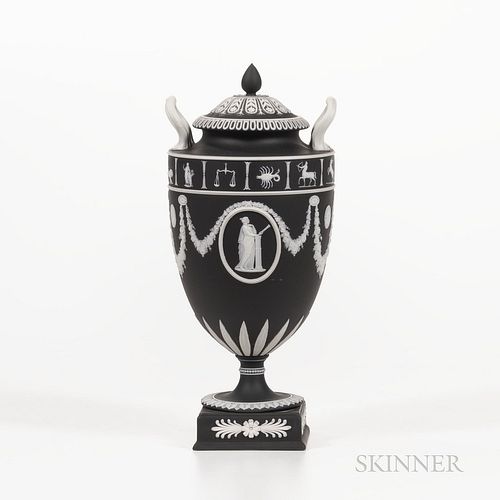 Wedgwood Black Jasper Dip Zodiac Vase and Cover, England, 1952, applied white relief with floral festoons terminating at oval medallion