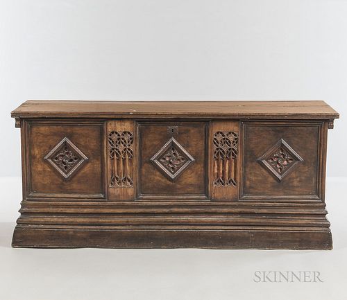 Gothic-style Walnut Chest, with a hinged lid and carved tracery panels, ht. 29 3/4, wd. 69, dp. 22 3/4 in.