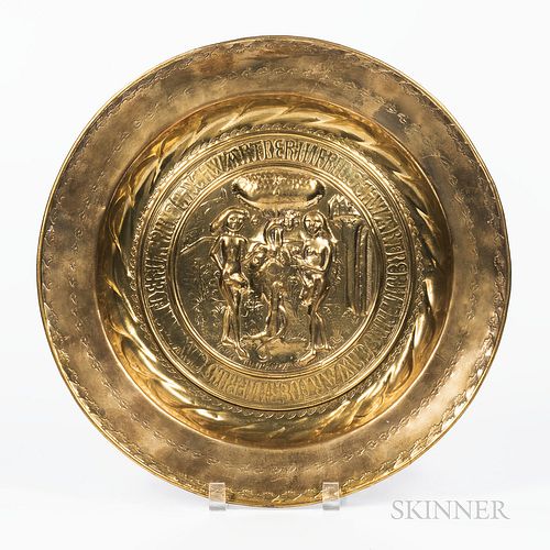 Nuremburg Brass Adam & Eve Alms Dish, Germany, 17th/18th century, punchwork leaves bordering a band of German text surrounding a centra