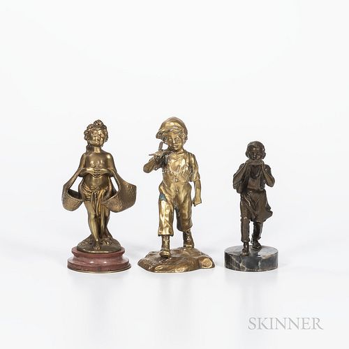 Three Small Bronze Figures, a boy carrying a small cross over his shoulders by Antoine Bofill (Spanish/French, active 1894-1939), signe