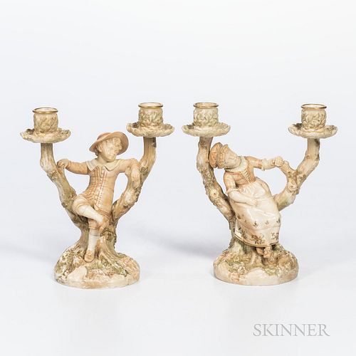 Pair of Royal Worcester Porcelain Figural Two-light Candelabra, England, 1886, each with gilt trim and enamel colors and modeled as a b