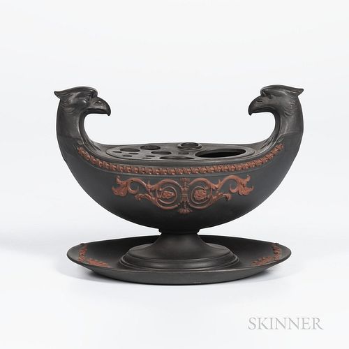 Wedgwood Black Basalt Inkstand, England, early 19th century, bird-head handles with applied rosso antico arabesque flowers below a coil