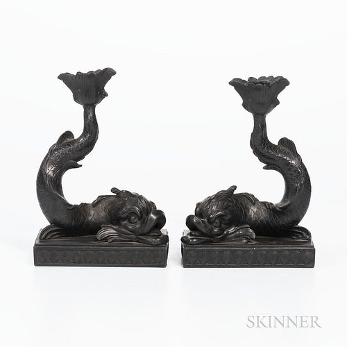 Pair of Wedgwood Black Basalt Dolphin Candlesticks, England, 19th century, mounted atop rectangular bases with shell borders, impressed