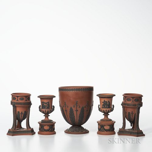 Five Wedgwood Rosso Antico Items, England, 19th century, each with black basalt relief, a pair of tripod base incense burners, ht. 6 3/