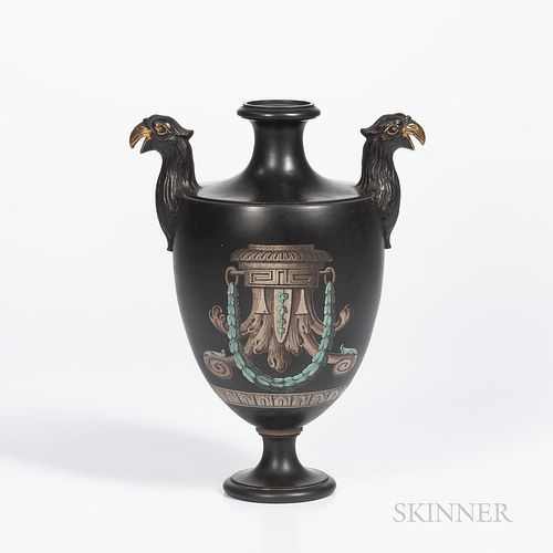 Encaustic and Gilded Black Basalt Vase, England, 19th century, molded bird handles, iron, red, black and white with shaped cartouche of