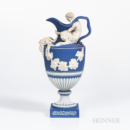 Wedgwood Dark Blue Jasper Dip Wine Ewer, England, early 19th century, applied white relief with Bacchus seated on the shoulder and hold