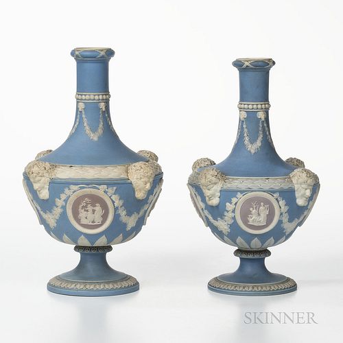Two Wedgwood Tricolor Jasper Dip Barber Bottles, England, c. 1867, each light blue ground with lilac medallions and applied white relie