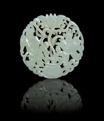 A Pierce Carved Jade Circular Plaque Diameter 2 1/8 inches.