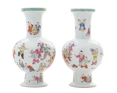 A Pair of Famille Rose Porcelain Vases Height of pair 8 7/8 inches.