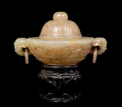 A Mughal-Style Carved Jade Jar and Cover Height of jade 3 1/2 x width over handles 5 7/8 inches.