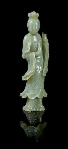 * A Celadon Jade Figure of Guanyin POSSIBLY 19TH CENTURY Height 9 inches.