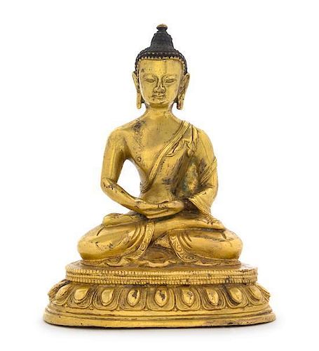 A Gilt Bronze Figure of Buddha Height 5 7/8 inches.