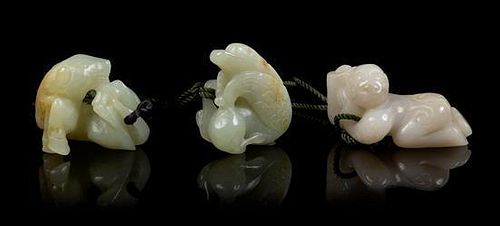 * Three Carved Jade Pendants Length of longest 2 inches.