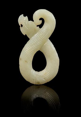* A Carved Jade Pendant Length 3 1/8 inches.