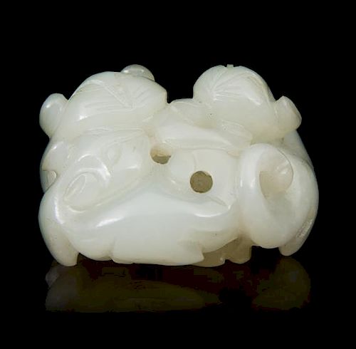 * A Carved Jade Toggle Length 1 3/4 inches.