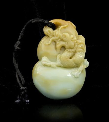 * A Carved Jade Toggle Length 3 1/4 inches.
