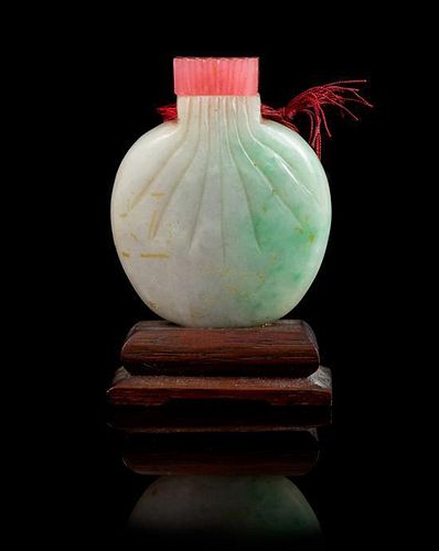 * A Jadeite Snuff Bottle MID-LATE QING DYNASTY Height 2 5/8 inches (with stand).