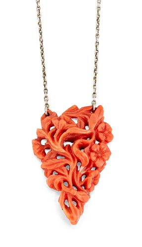 A CARVED CORAL NECKLACE, the triangular coral pendant carve