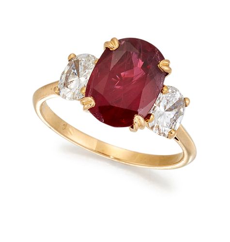 A THREE STONE RUBY AND DIAMOND RING, the oval ruby, estimat