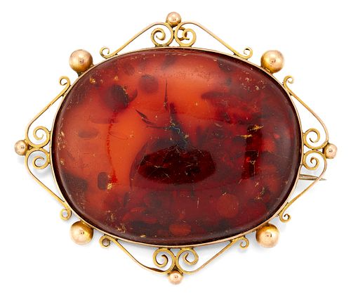 AN AMBER BROOCH, the oval amber specimen brooch, collet mou