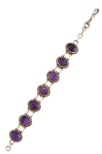A SILVER AND AMETHYST BRACELET, the oval amethyst cabochons