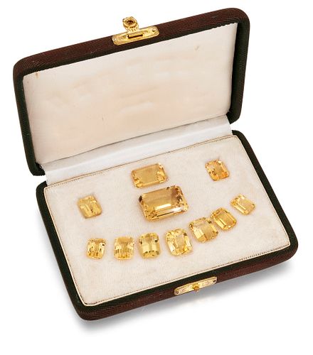 A CASED SET OF EMERALD CUT CITRINES, largest measures appro