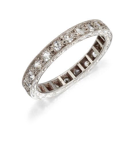 A 9 CARAT GOLD DIAMOND ETERNITY RING, the old brilliant cut