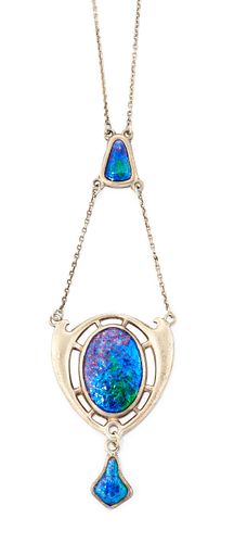 A SILVER AND ENAMEL PENDANT BY CHARLES HORNER, the central 