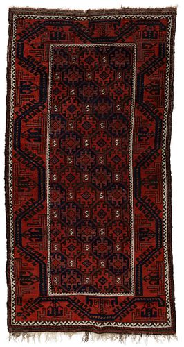 A FINE AND NOTABLE ANTIQUE BALOUCH ORIENTAL RUG