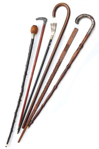 A COLLECTION OF CANES, WALKING STICKS AND SIMILAR ITEMS