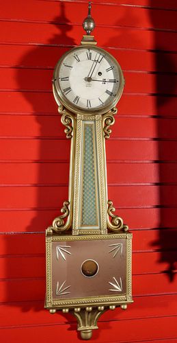 AN EARLY 20TH CENTURY BANJO CLOCK SIGNED E. E. ORVIS