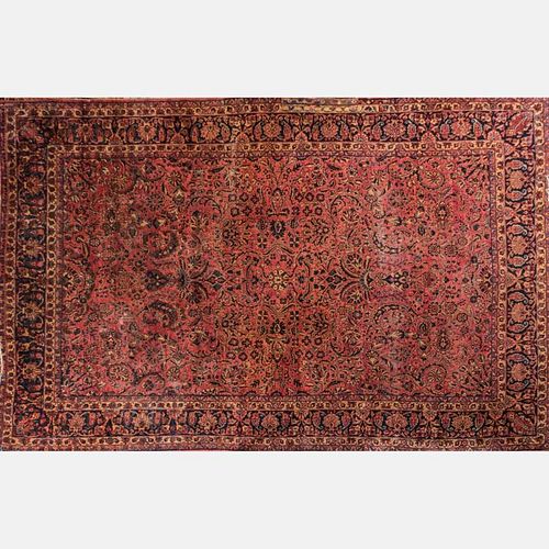 A Persian Wool Rug, 20th Century.