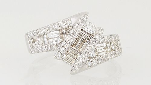 Lady's 14K White Gold Dinner Ring, with a central diagonal band of baguette diamonds, flanked by outer bands of round diamonds, on a...