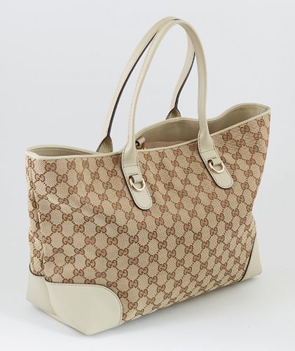 Gucci Beige Monogrammed Canvas and Ivory Leather Hearbit Tote, the exterior with golden brass and bamboo heart charm, opening to a l...