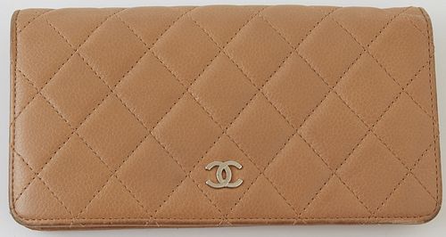 Coco Chanel Logo Classic Long Bifold Wallet, the brown calf quilted leather with silver accents, opening to card and bill holders, a...