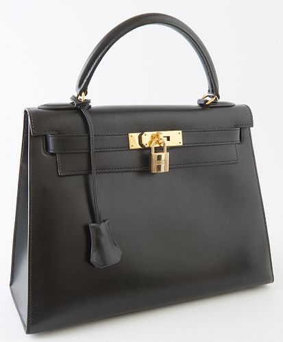 Hermes Kelly Sellier Black Box Leather Handbag, c. 1992, with gold hardware, opening to a black leather interior, one side with a zi...