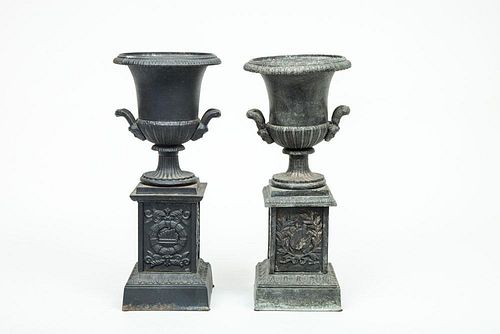 Two Similar Neoclassical Style Cast-Iron Mantel Urns