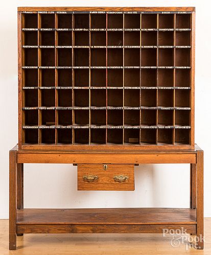 Oak two-part post office cabinet, early 20th c.