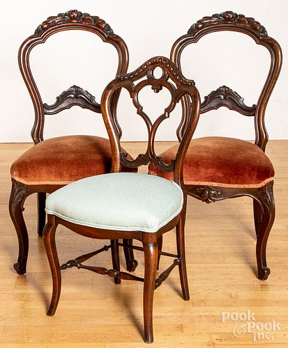 Three Victorian carved walnut side chairs