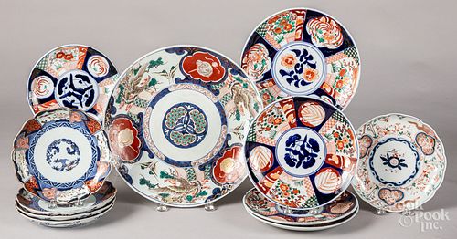Eleven Imari porcelain plates and chargers