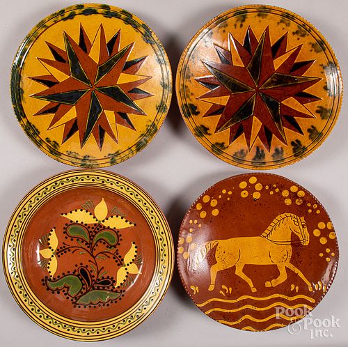 Four Breininger redware chargers