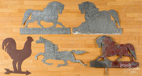 Four cut zinc horses and a rooster