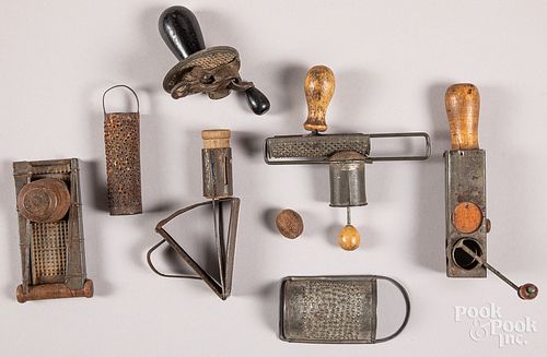Collection of seven tin nutmeg graters, 19th c.