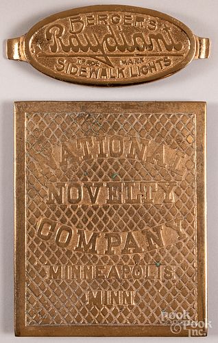 Two brass advertising placards